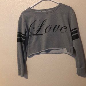 a cropped grey sweater